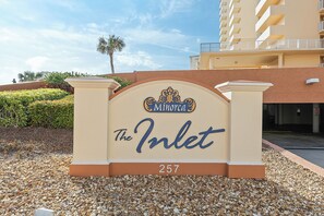 A hotel entrance sign with the name "The Inlet" and the number "257". - 🌴Best Views in NSB | XL Oceanfront + Intracoastal Balcony | Minorca Inlet 606🐬 (New Smyrna Beach)