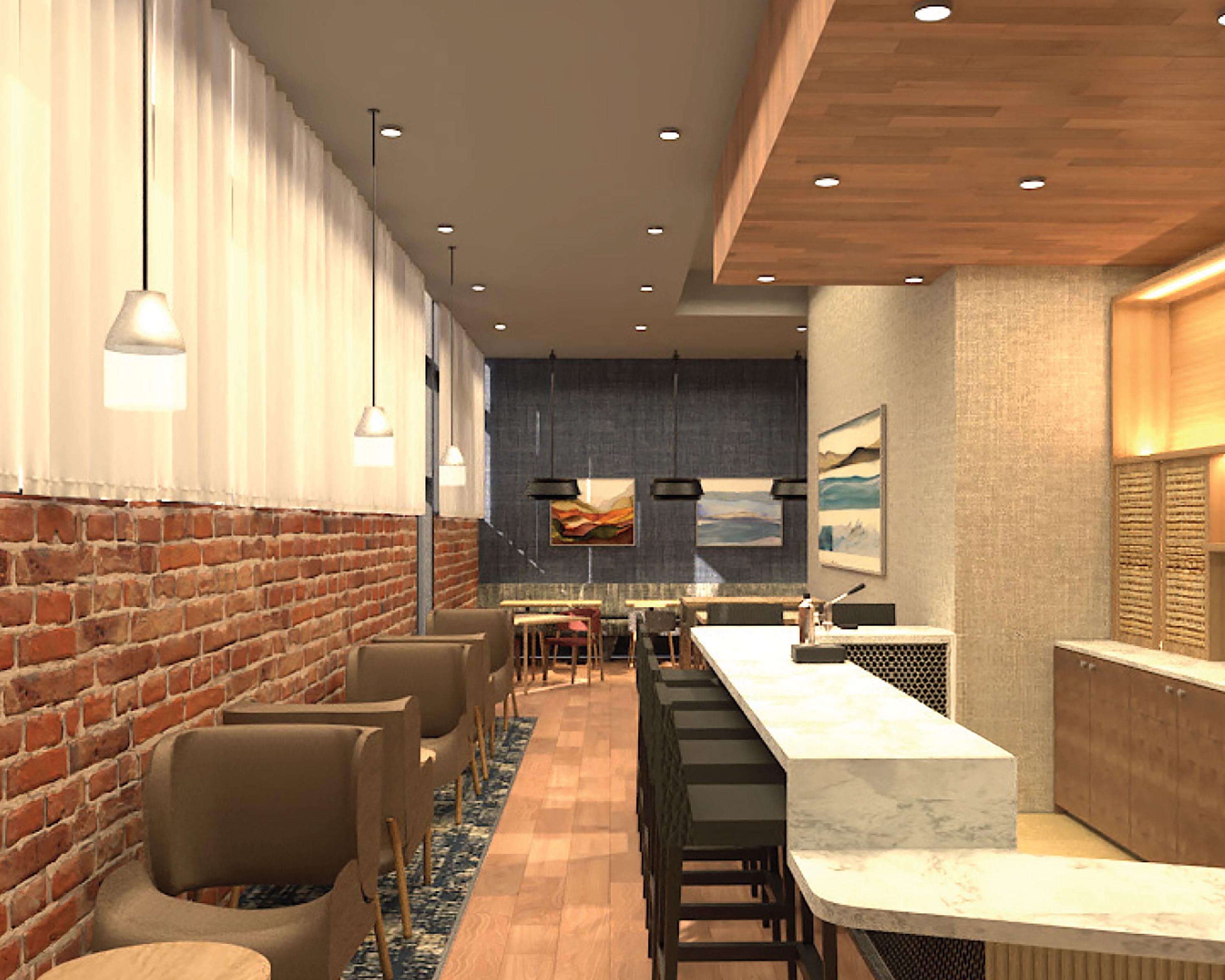 A modern interior with a brick wall, wooden ceiling, and a long counter with seating.