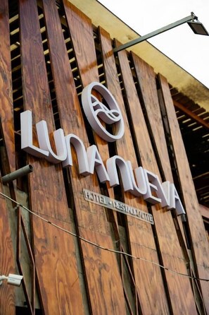 A hotel sign with the name 'LUNANEVA' and the words 'HOTEL RESTAURANT' below it. - Luna Nueva de Colan (Colán)