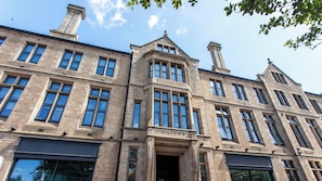A multi-story building with a prominent entrance labeled 'GILLOWS.' - Student Only The Gillows (Lancaster)