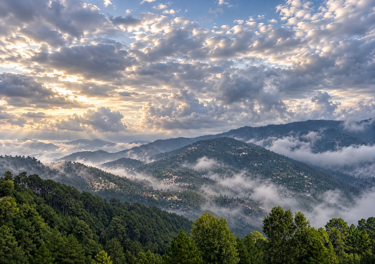 A mountainous landscape with a village nestled among the hills, surrounded by dense forests and a cloudy sky.