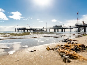 A pier extending into the water with a clear sky above. - 5 - Konigstrasse 5 (Wyk auf Foehr)