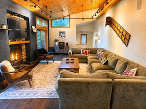 A cozy living room with a fireplace, a sofa set, and a wooden ceiling. - Luxury Windham Escape w/ Hot Tub, Views & Walk to Mountain (Windham)