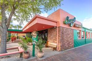 A building with a sign reading 'Clancy's Cantina' and a bell-shaped structure in front. - Lala's Luxe Getaway (New Smyrna Beach)