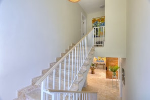 A staircase with white railings leading to a landing. - Villa Calista Elegant Holiday Villa (Adeje)
