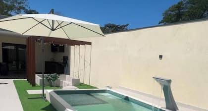 Heated pool, bathtub with TV, fire pit, pool table, JBL party system, and more.