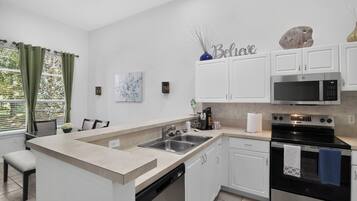 Coffee/tea maker, fridge, microwave, oven