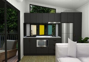 Una cuina moderna amb armaris foscos, un refrigerador d'acer inoxidable i un forn integrat.