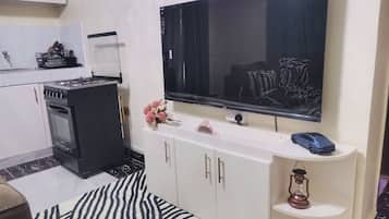 A modern kitchen with a built-in stove, oven, and microwave.