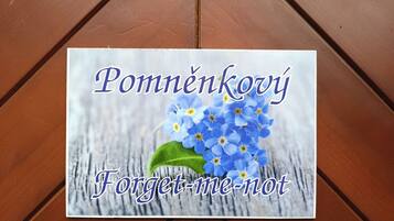 A card with a blue flower design and text.