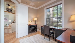 A room with a desk, chair, and a large window with blinds. - Welcome to Palma Verde, a refined waterfront retreat where comfort, craftsmanshi (Marco Island)