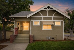 A two-story house with a front porch, a visible number '3357' on the door, and a brick staircase leading to the entrance. - Beautifully Remodeled 2 Bed / 2 Bath Home Near UC Davis Medical Center (Sacramento)