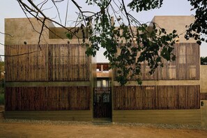 A modern building with a wooden facade and a central entrance.