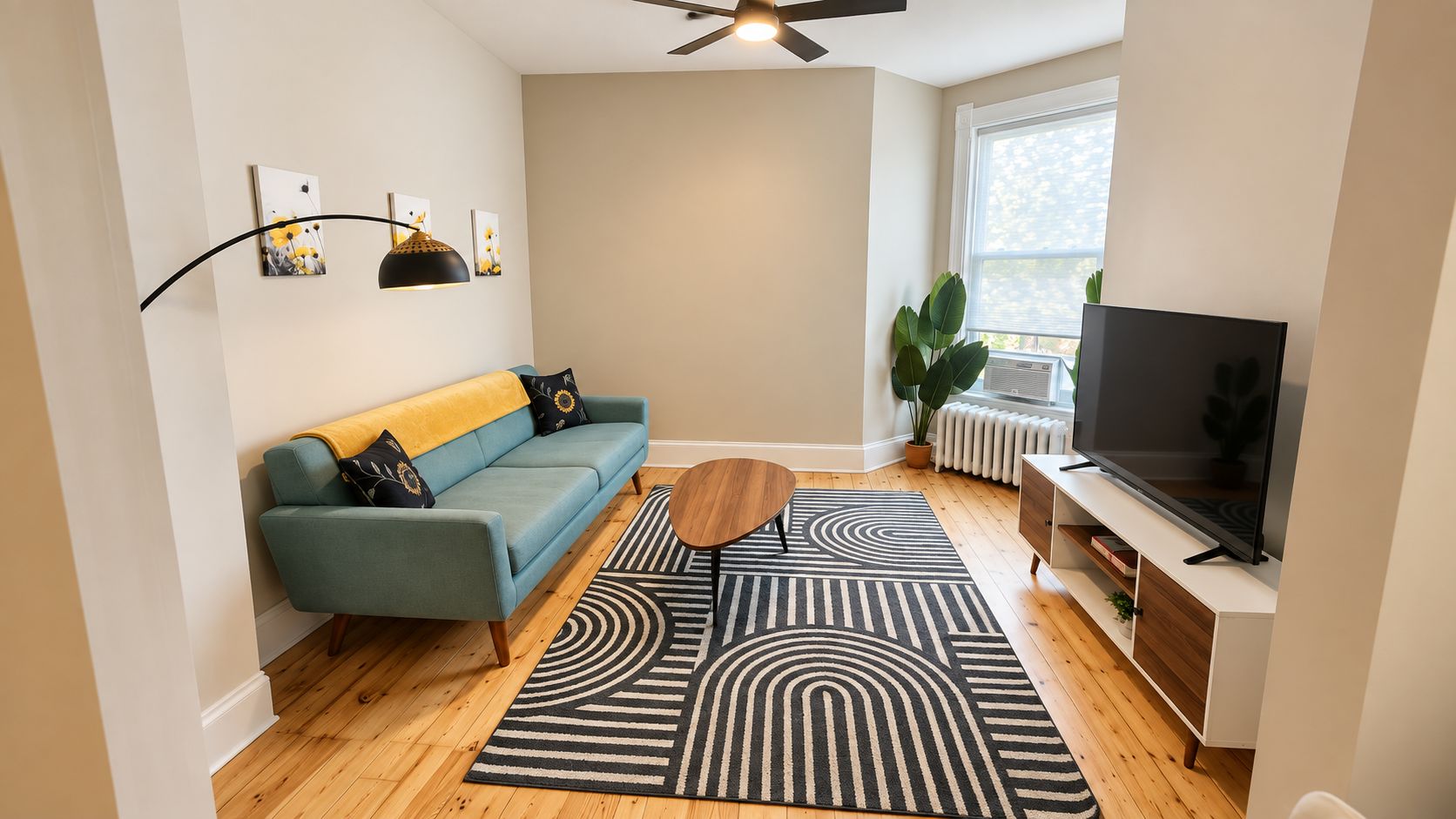 A modern living room with a sofa, coffee table, and TV.