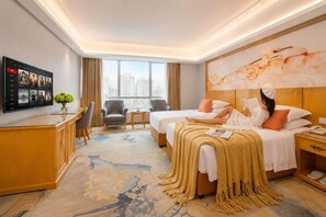 A hotel room with two beds, a desk, a TV, and a large window with a city view. - AII Seasons Beijing Campbell Street Hotel (Guangzhou)