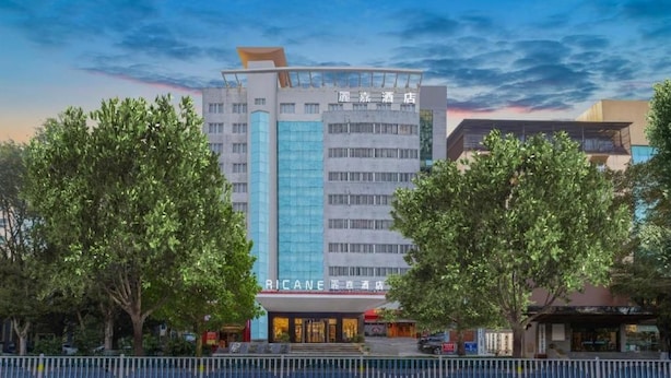 A hotel with a modern facade, multiple floors, and a prominent entrance. - Lavande Hotel (Ganzhou)