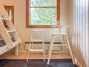 A room with a window, a white step ladder, and a white chair. - Renovated 2 BD+ loft by the lake, free wifi, sauna (Kuusamo)