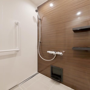 A bathroom with a shower, a towel rack, and a small shelf. - Tanigawa Hotel Nanaeyae (Nikko)