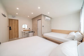 A hotel room with two beds, a desk, a mirror, a wardrobe, and an air conditioning unit. - Melo Stay Seoul (Seoul)