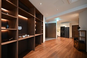 A modern kitchen with wooden cabinetry and built-in appliances. - Anon Stay (Seoul)