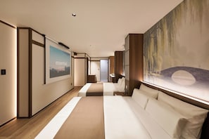 A hotel room with a large bed, a desk, and a painting on the wall. - Stay Passport Kinosaki Ryokan Daejeon Yucheon by Anuk (Daejeon)