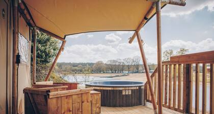 Camping, with the luxury of home? Stay in a Glamfield Lodge Premium with hot tub for 4 people at Wilsumer Berge