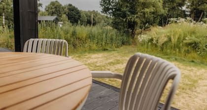 Enjoy a relaxing stay in an eco-friendly home with a hot tub and secluded location. The green sedum roof provides a natural look and sustainable insulation.