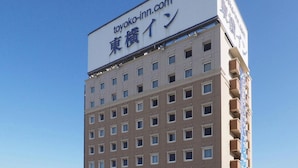 A multi-story building with a sign indicating it is a hotel. - Toyoko Inn Kitakami Eki Shinkansen Guchi (Kitakami)