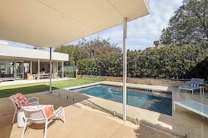 A swimming pool with a covered patio area, outdoor furniture, and a view of a residential building. - Stillwater House - Poolside Serenity by the Bay (Dunsborough)
