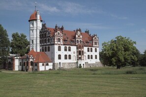 A large, historic building with multiple towers and a prominent central tower. - Holiday apartment in Jabel with swimming pool (Jabel)
