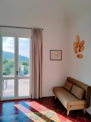 Quarto casal luxo, vista para o mar | Área de estar