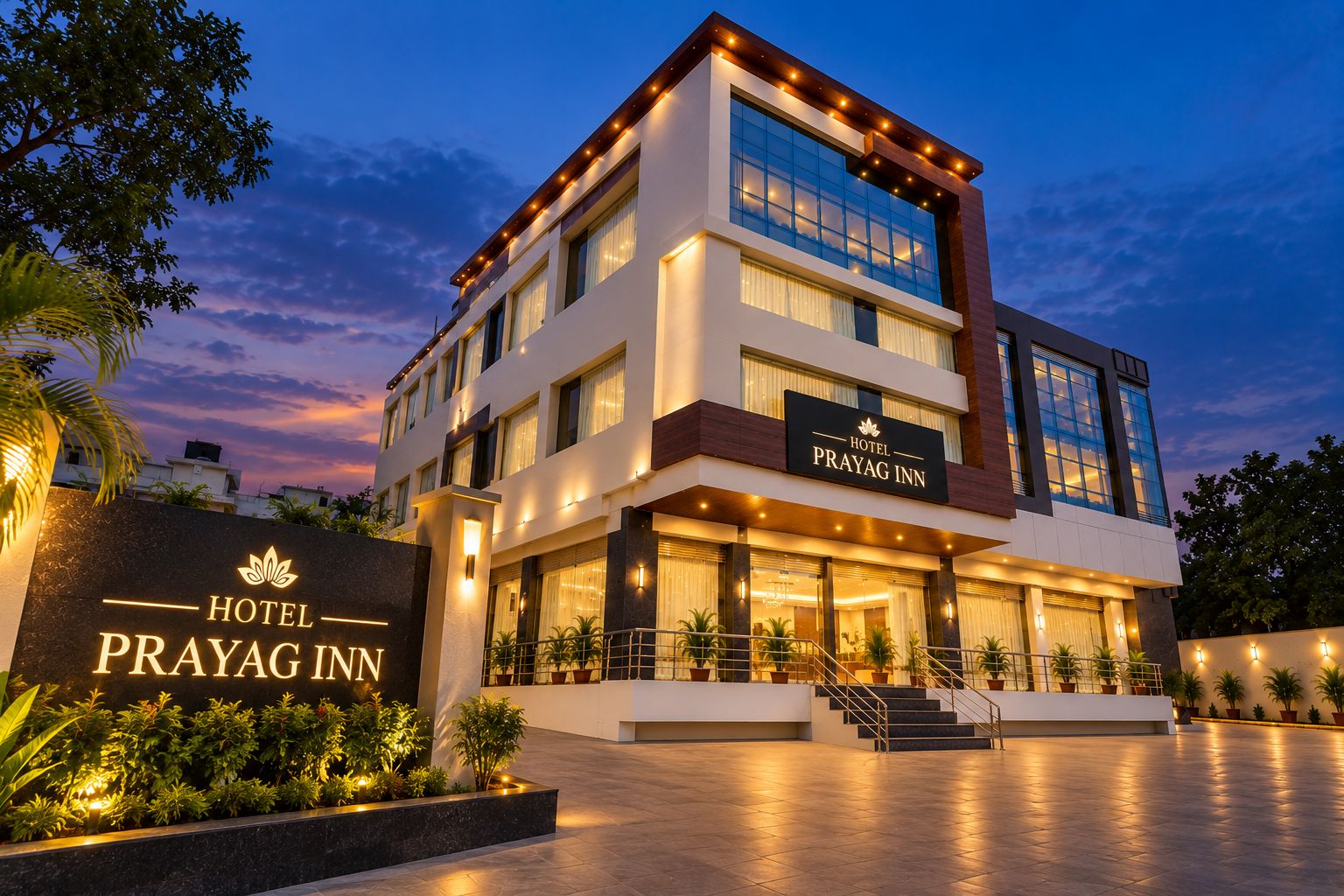 A multi-story hotel with a prominent entrance, a signboard, and a well-lit facade.