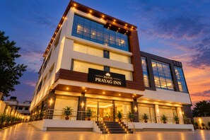 A multi-story hotel with a prominent sign reading 'PRAYAG INN HOTEL'. - Hotel Prayag Inn (Chhatrapati Sambhajinagar)