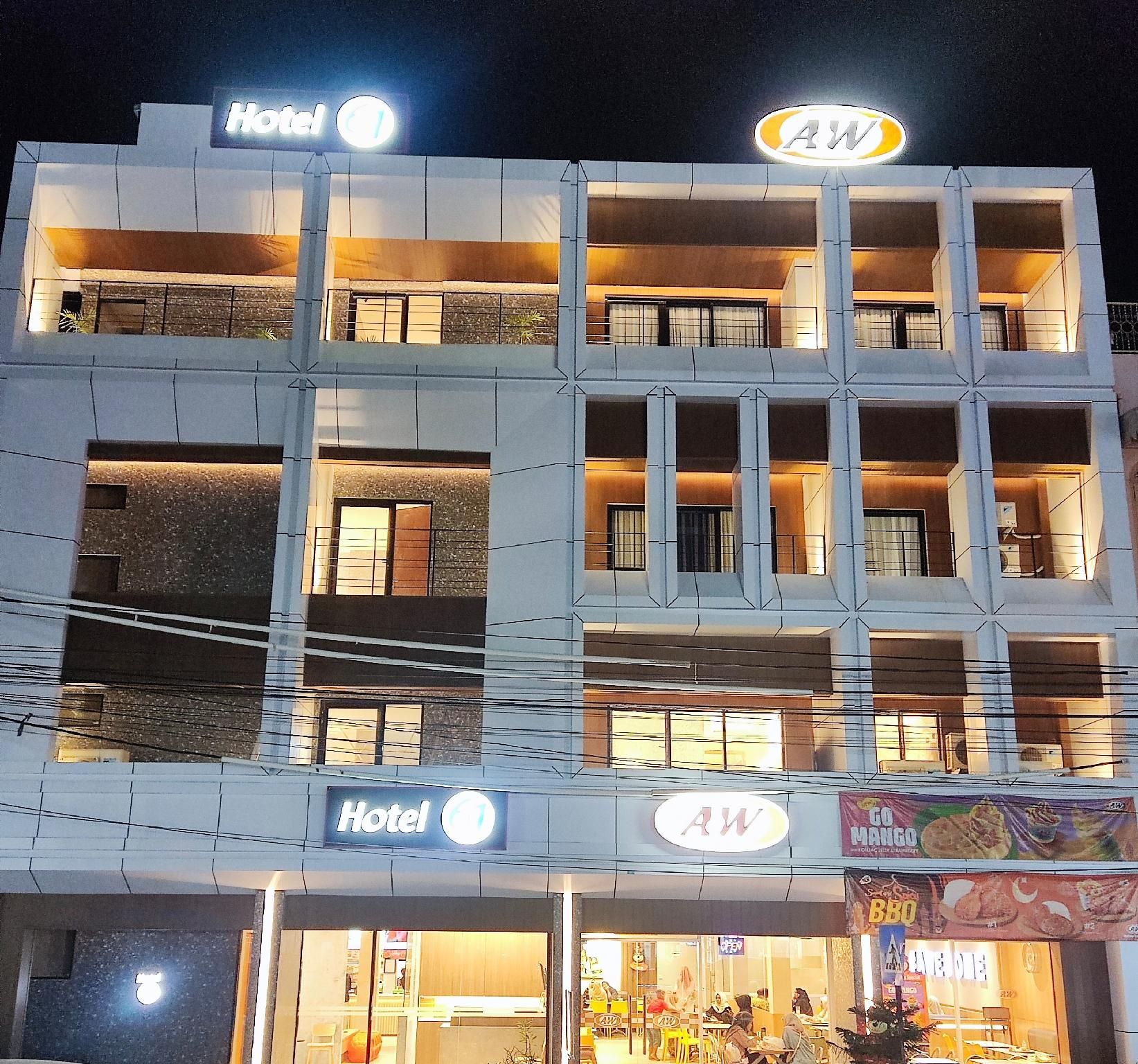 A multi-story hotel with balconies, a restaurant, and a visible sign for a mango dessert.