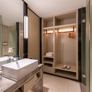 A modern bathroom with a double sink vanity, a walk-in shower, and a built-in storage closet. - Echarm Hotel (Guangzhou)