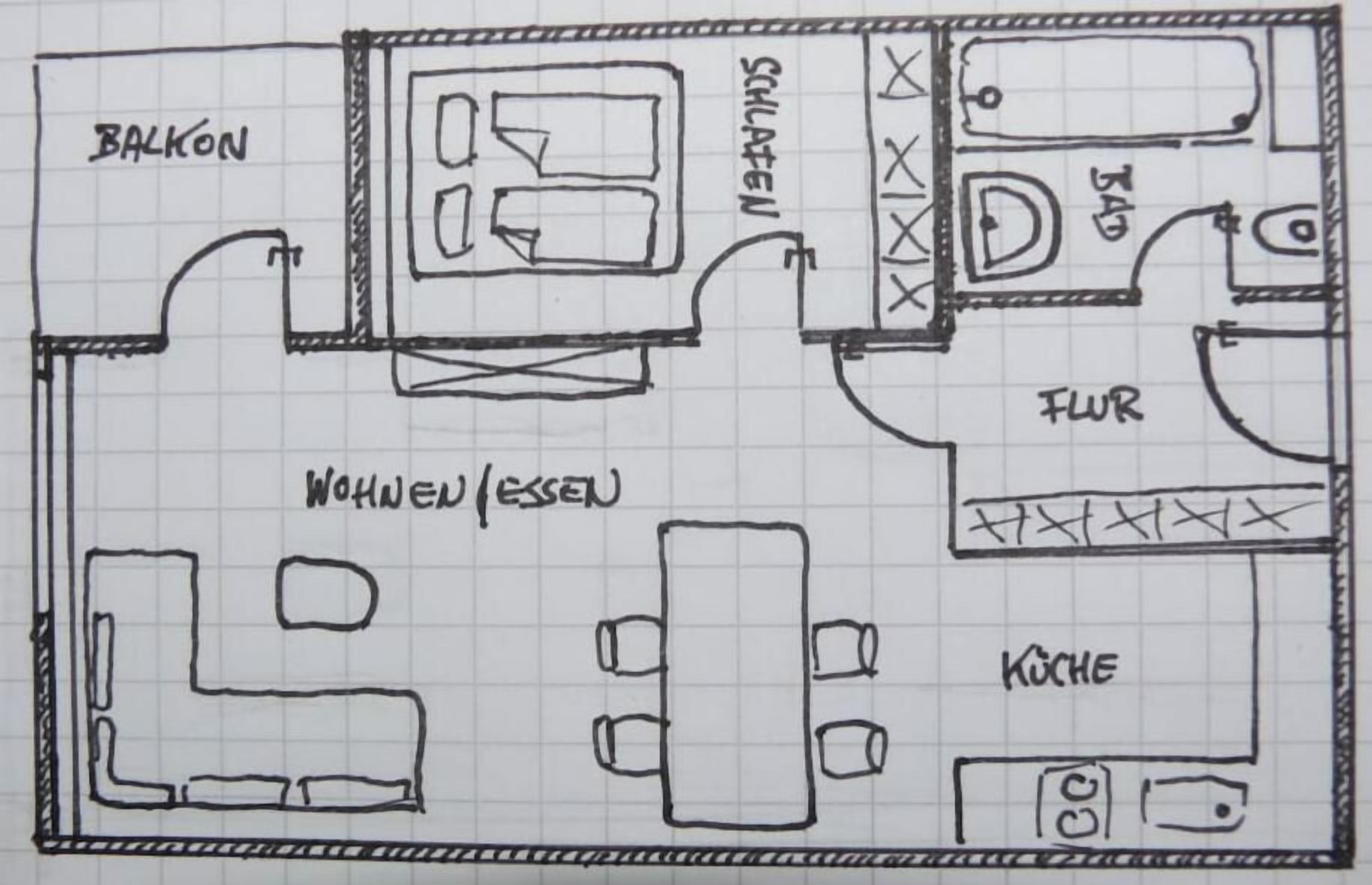 Ein Grundriss mit Balkon, Wohnzimmer, Küche und Bad.