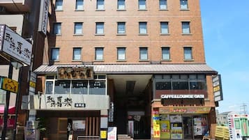 A multi-story building with a ground-level cafe and lounge.