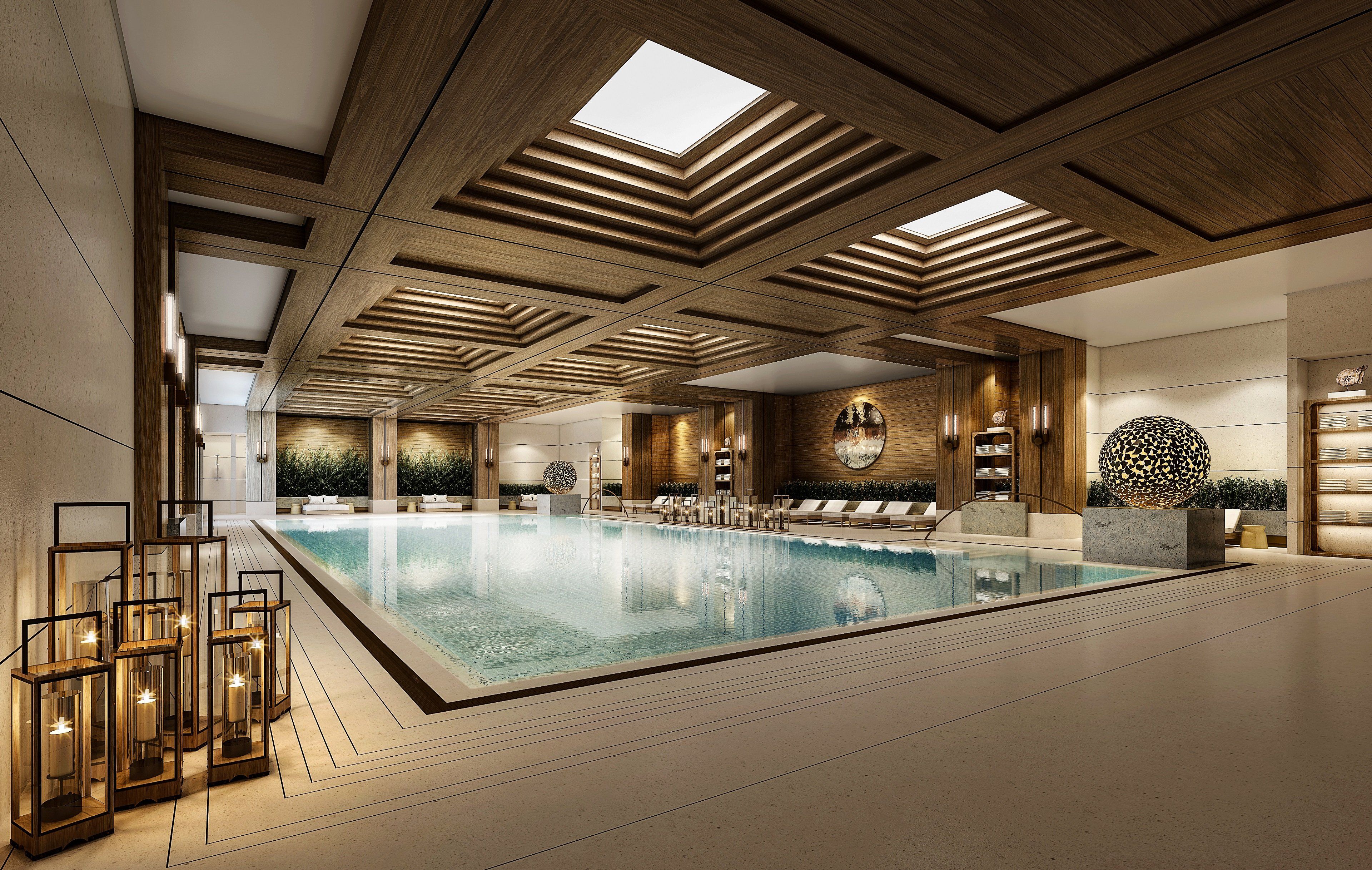 A spacious indoor swimming pool with a modern design, wooden ceiling, and lounge area with seating.