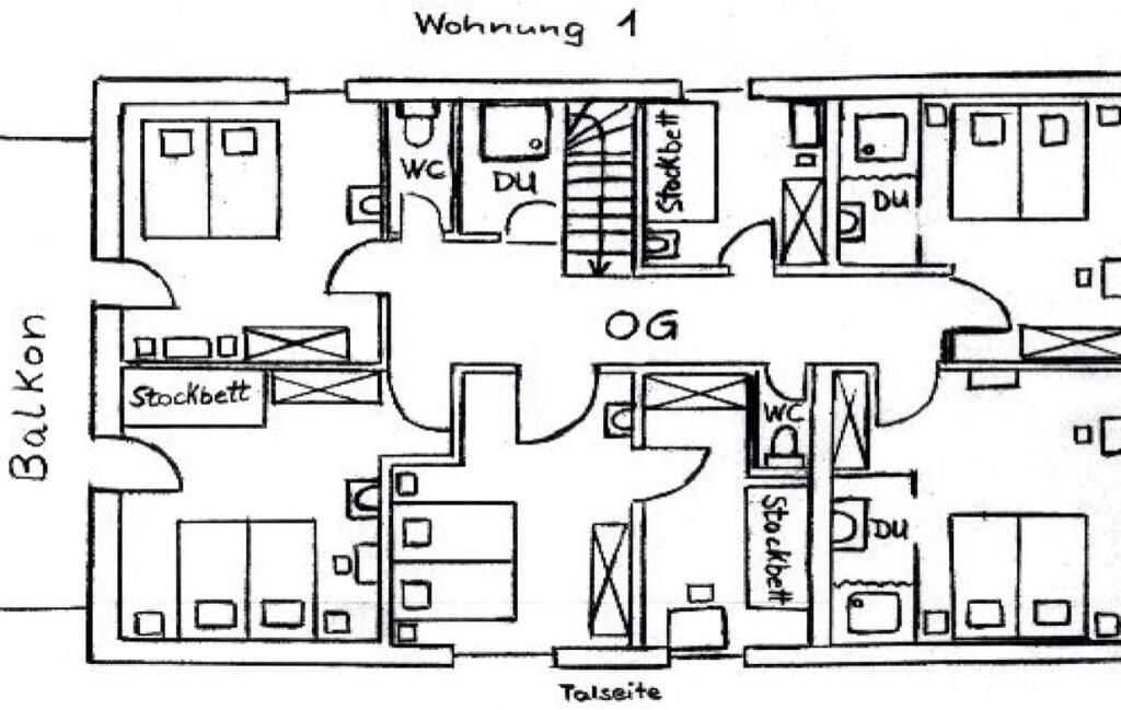 A floor plan of a building with multiple rooms, including a balcony, a toilet, and a storage area.