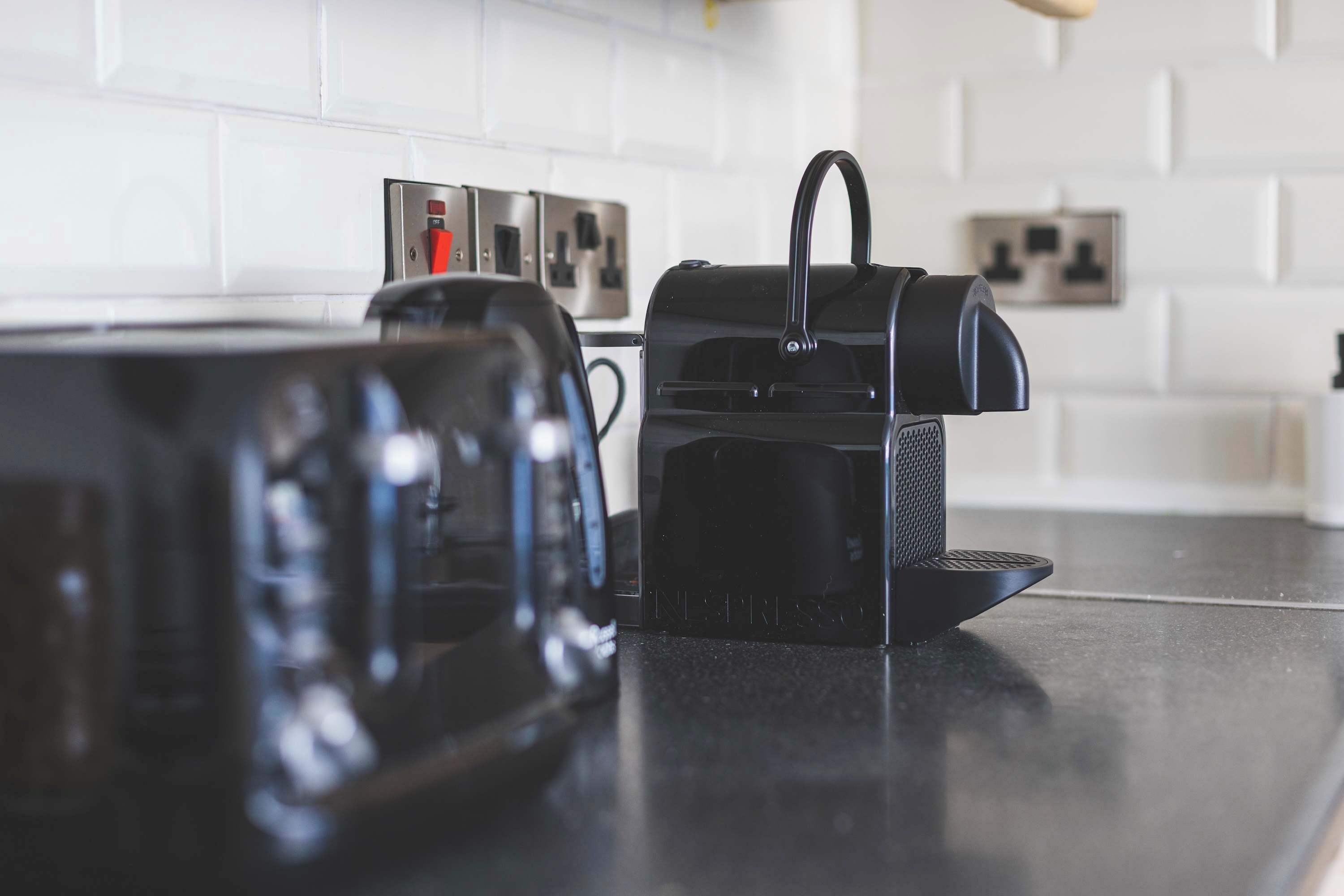 A kitchen counter with a coffee maker and a toaster.
