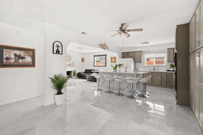 A fully stocked kitchen with generous counter space for cooking for a crowd.