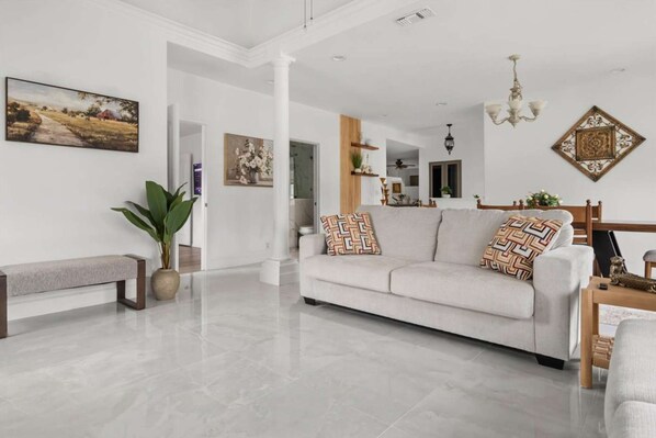 A bright, airy sitting area with extra bench seating for larger groups.