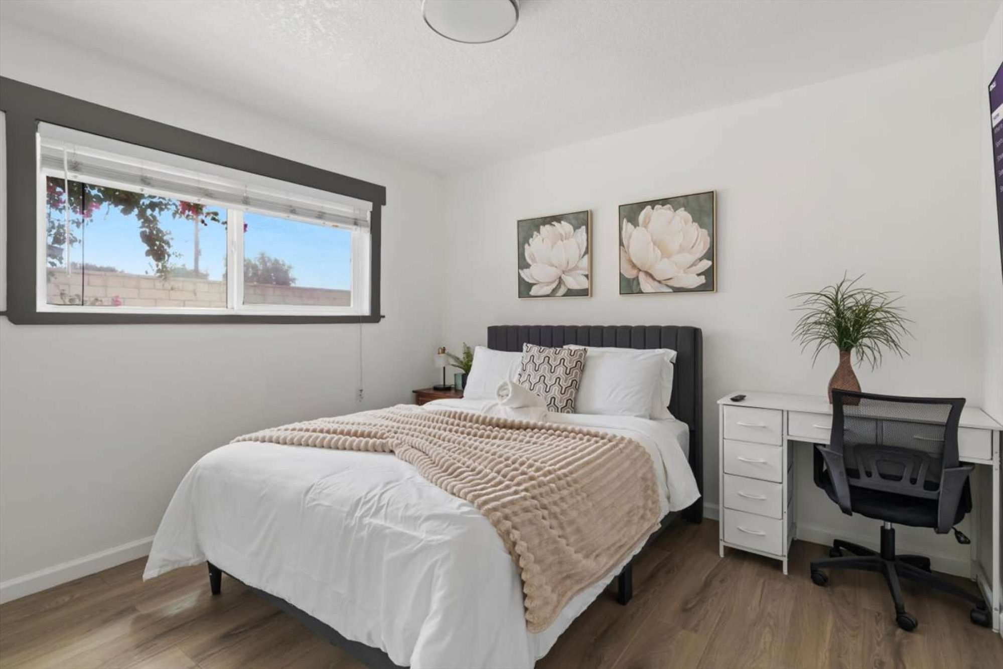 Bedroom 3: Comfortable queen memory foam mattress protected by a waterproof and bed bug proof mattress protector, with a seat by the window.