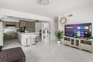 The second living area opens toward the kitchen, keeping the whole home connected.