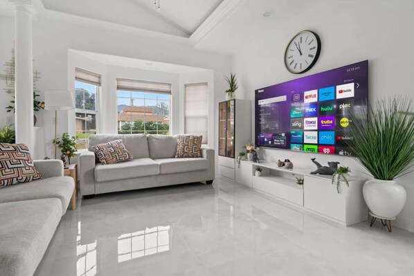 Sink into the sectional and enjoy the large flat-screen TV in the main living room.