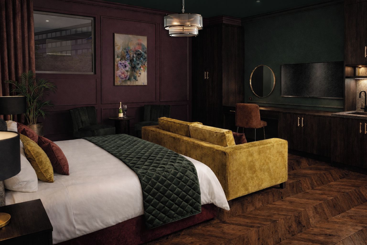 A hotel room with a bed, a sofa, a television, and a mirror.
