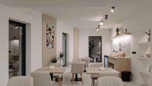 A modern dining area with multiple tables and chairs, a kitchen counter with food items, and a decorative wall piece. - Arbor Hotel (Sovata)