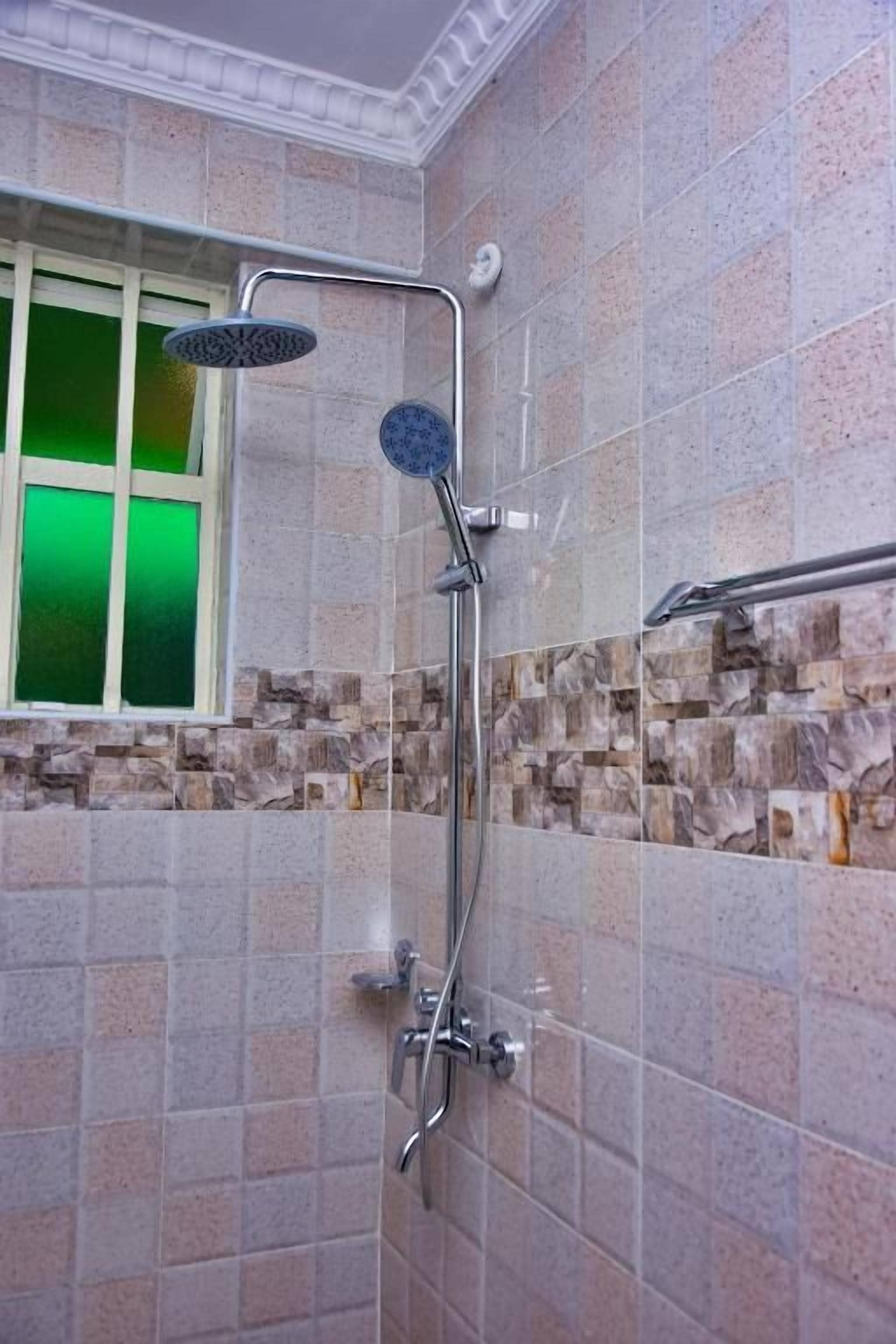 Shower, free toiletries, slippers, towels