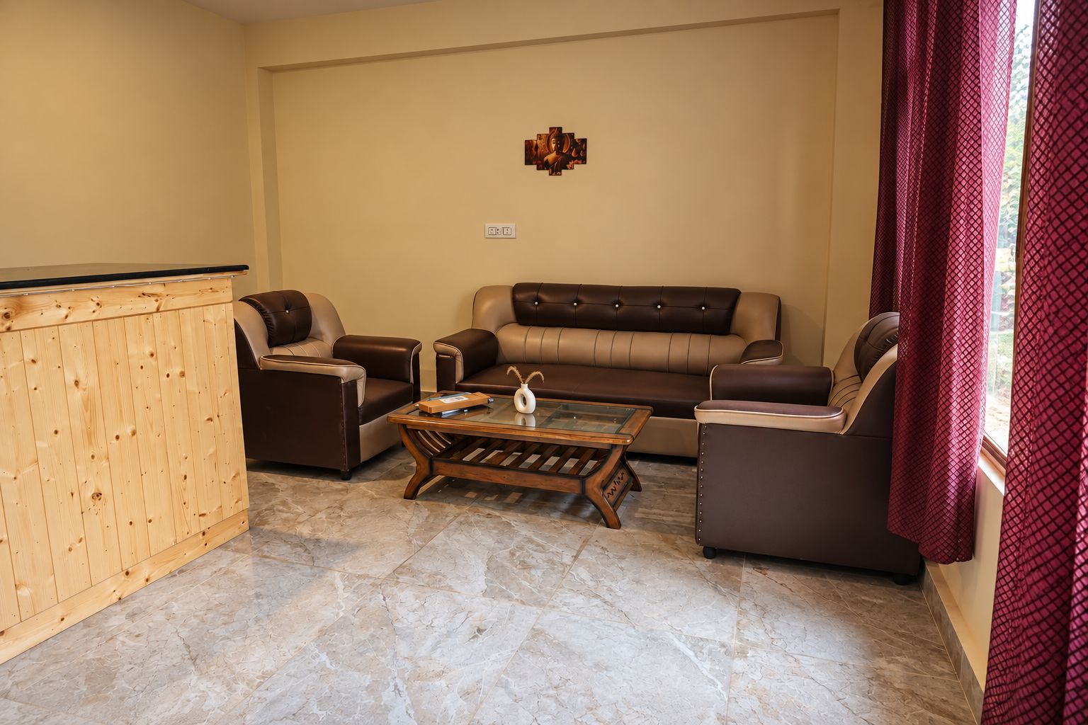 A living room with a sofa, two armchairs, a coffee table, and a wooden cabinet.