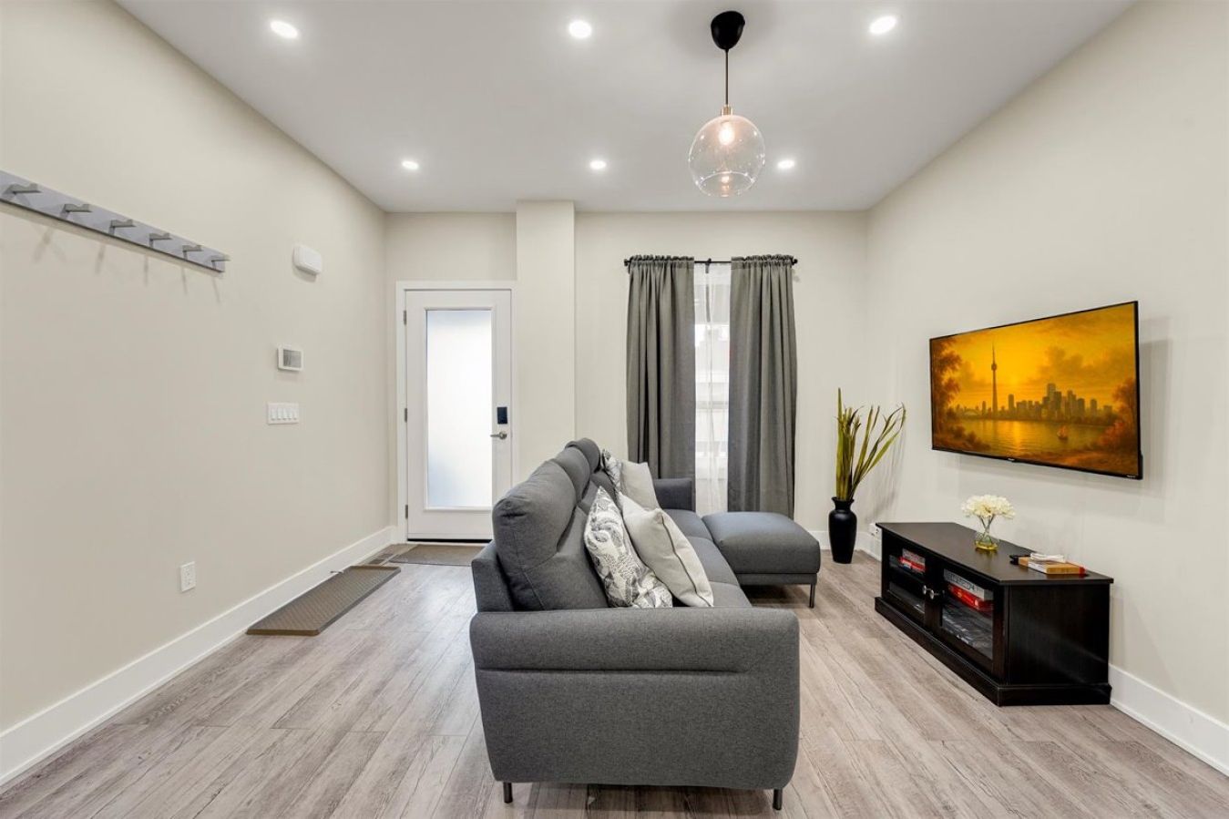 Step into a bright, modern open-concept living space designed for relaxation and style.